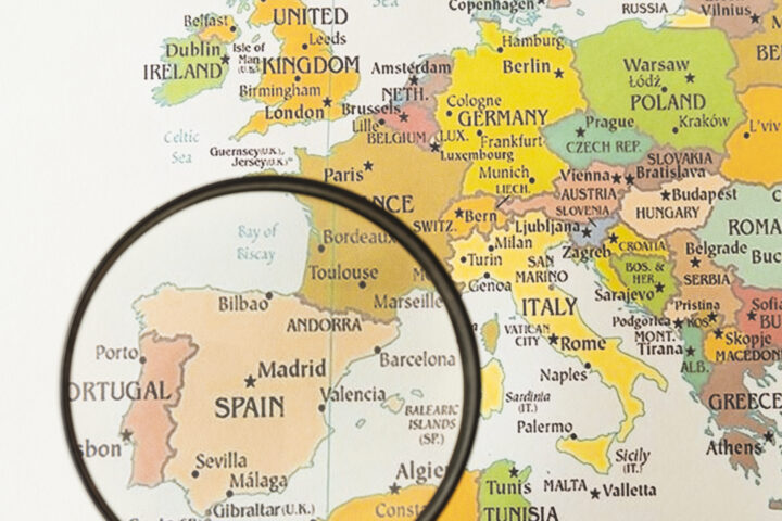 close up magnifying glass showing spain | Lumen Kinnisvarabüroo